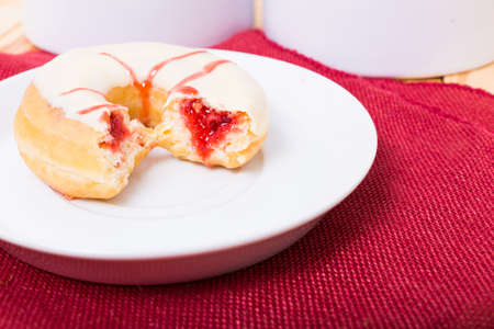 deliciout donut with strawberry cake fillingの写真素材