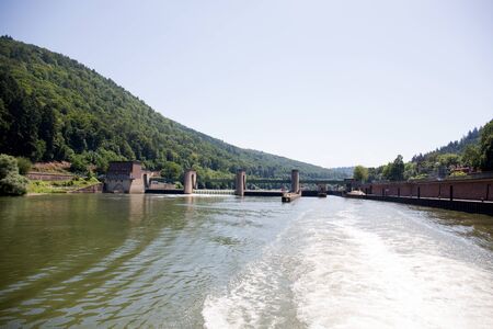 View on the bridge with trees photographed during a tour by ship on the neckar in germany