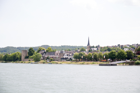 View on a building with a church at the riverbank in Koblenzのeditorial素材
