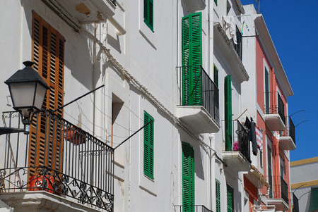 Typical house facades in Ibiza Town, Spain. The official name of Ibiza Town is the Catalan Eivissa or Eivissa Townの写真素材