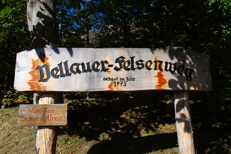 Hiking sign for the Vellau Rock Trail, South Tyrol, Italy. Translation 'Only for those who are free from giddiness' only for giddiness-free peopleの写真素材
