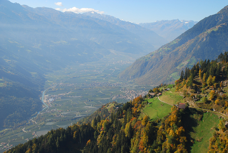 Panorama view on valleys and mountains (Texel Group) in the italian alps standing at the Hans-Frieden-Felsenweg (Meran, South Tyrol, Italy)の写真素材