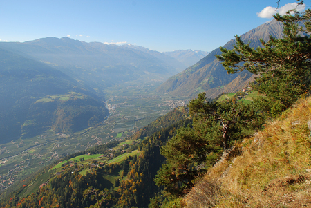Panorama view on valleys and mountains (Texel Group) in the italian alps standing at the Hans-Frieden-Felsenweg (Meran, South Tyrol, Italy)の写真素材