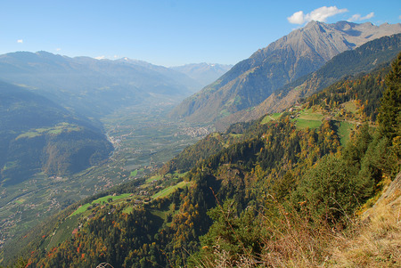 Panorama view on valleys and mountains (Texel Group) in the italian alps standing at the Hans-Frieden-Felsenweg (Meran, South Tyrol, Italy)の写真素材
