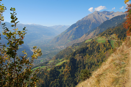 Panorama view on valleys and mountains (Texel Group) in the italian alps standing at the Hans-Frieden-Felsenweg (Meran, South Tyrol, Italy)の写真素材