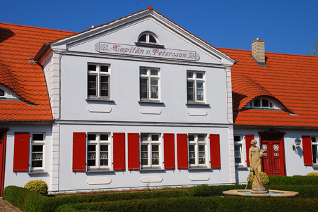 Typical old building in Born, Darss, Germany. House of the Captain Petersson. The  Darss is the middle part of the peninsula of Fischland-Darss-Zingst on the southern shore of the Baltic Seaの写真素材