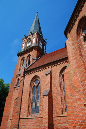 Wustrow church: nineteenth century Gothic Revival brick church with an 18 metre high steeple. Wustrow is a municipality at Baltic Sea coast in Mecklenburg-Vorpommern, Fischland, Germanyの写真素材