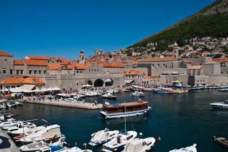 Dubrovnik, Croatia: View of the Old Port. Dubrovnik is a Croatian city on the Adriatic Sea. It is one of the most prominent tourist destinations in the Mediterranean Seaの写真素材