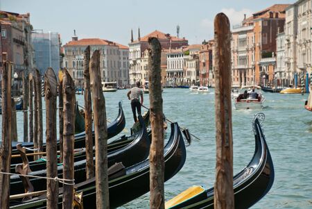 Venice, Italy: Traditional Gondolas floating on Grand Canal near the Rialto Bridgeの写真素材