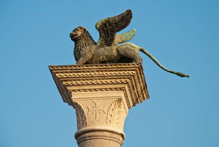 Venice, Italy: The column in the Piazzetta di San Marco with a sculpture of the Lion of Venice on top of itの写真素材