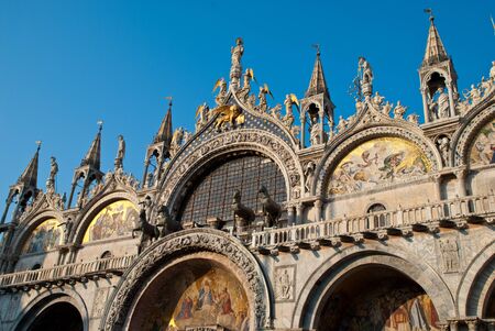 Venice, Italy: The Basilica of St Mark's, facade, the Triumphal Quadriga or Horses of Saint Mark is a set of Roman or Greek bronze statues of four horsesの写真素材