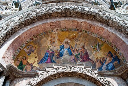 Venice, Italy: outer facade West, Mosaic of the St. Mark's Basilica, Hauptportal. Jesus Christ enthroned as Judge at the Last Judgmentの写真素材