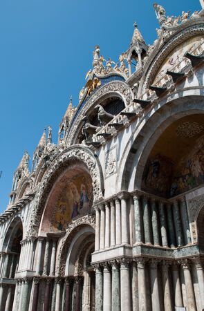 Venice, Italy: The Basilica of St Mark's, entrance and facade, the Triumphal Quadriga or Horses of Saint Mark is a set of Roman or Greek bronze statues of four horsesの写真素材