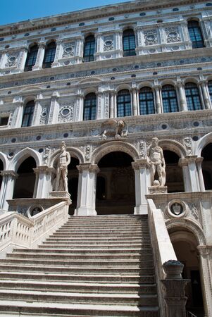 Venice, Italy: Doge's Palace courtyard, Giants' Staircase. Statues of Mars and Neptune guard the top of the staircase that represents Venice's power by land and by sea.の写真素材