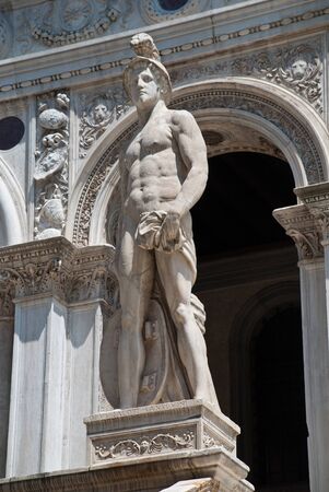 Venice, Italy: A statue of Mars - The Roman God of War, located at the Giants Staircase at the Doges Palace (Palazzo Ducale). The statue represents Venice's power by landの写真素材