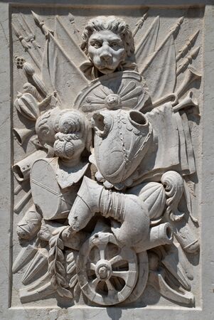 Venice, Italy: Arco Foscari, Doge's Palace, courtyard, Partial view - Pedestal of the statue of Francesco Maria della Rovere with trophiesの写真素材