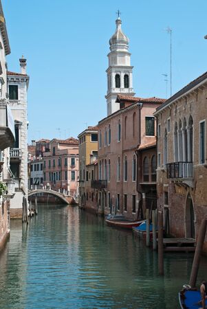 Venice, Italy: traditional buildings, canal Rio de la Pleta, Tower of church Sant'Antonin, a church in the sestiere (district) of Castelloの写真素材