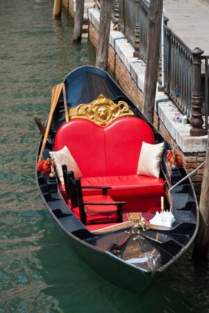 Venice, Italy: Traditional gondola in venetian water canal, close-upの写真素材