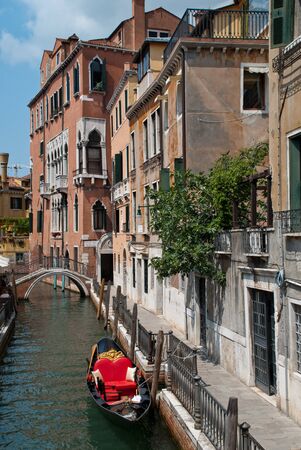 Venice, Italy: Traditional gondola in venetian water canal, close-up, district San Marcoの写真素材