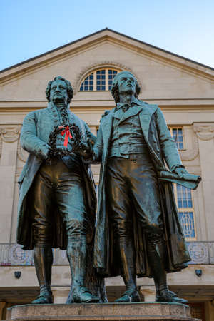 Weimar, Thuringia, Germany: monument of the famous writers Goethe and Schiller in front of the German National Theaterのeditorial素材