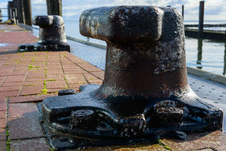 Wittduen, Schleswig-Holstein, North Friesland, Germany: rusty bollard at the ferry port of Wittduen on Amrum in the north seaの写真素材
