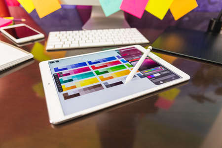 Graphic designer at work Creativity renovation and technology concept.Color swatch samples for selection coloring studioの写真素材