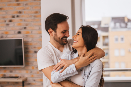 Couple hugging and smilingの写真素材