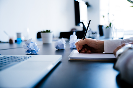 Female hand taking notes. Writing a business plan. Business People Conceptの写真素材