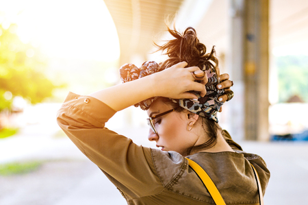 Woman tying her hairの写真素材