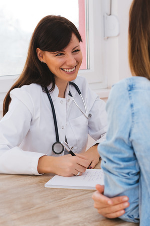 Doctor and patient are discussin. Consultation with doctor.の写真素材