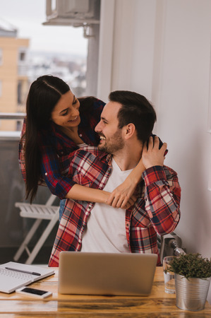Beautiful loving couple enjoying in work and conversation. Love and romance.の写真素材