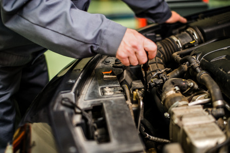 Close up of mechanic repairing the car.の写真素材