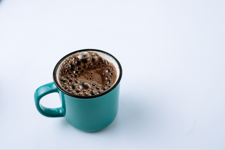 Cup of black coffee in enamel mug. Copy space.の写真素材