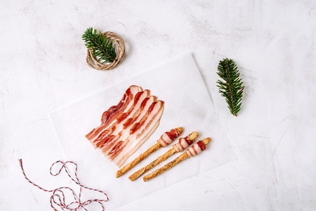 Tasty food. Sliced bacon on white background. の写真素材