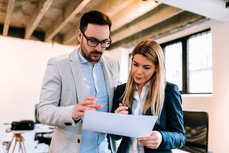 Collaboration is a key to best results. Business partners working on new startup business planの写真素材