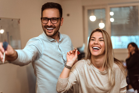 Image of business people having fun in office.の写真素材