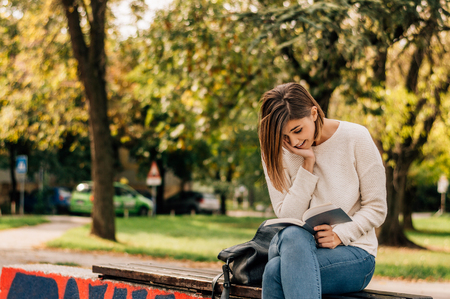 A shot of a college student reading a book.の写真素材