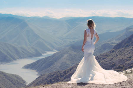Bride in the mountains. The concept of lifestyle and wedding