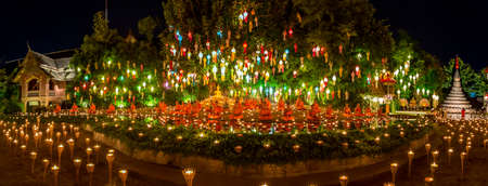 Wat Phan Tao, Chiangmai - November 9, 2014 : The monks come to take place praying and meditation on the Yee Peng  Festival's night. This festival is popular to the people and visitors to attend the event every year.のeditorial素材