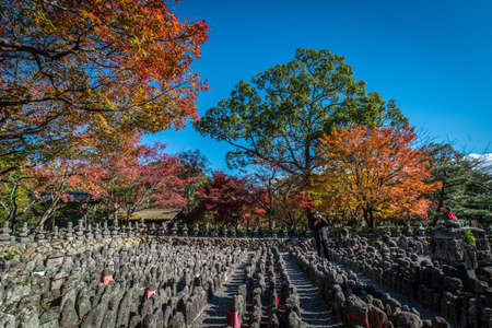 Tokyo, Japan - Nov 27, 2015 :  An unidentified tourist is walking in the middle of Buddhist statuettes on his vacation.のeditorial素材