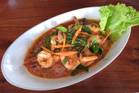Curry-fried shrimps in coconut milk and chilli by Thai style.の写真素材