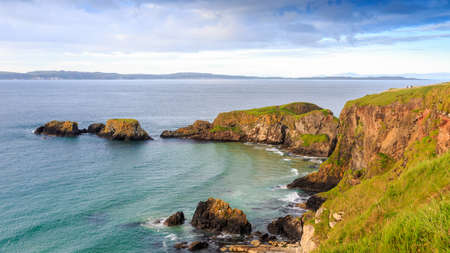 Carrick-a-Rede Rope Bridge  is a famous rope bridge near Ballintoy in County Antrim, Northern Ireland. The bridge links the mainland to the tiny island of Carrickarede.の写真素材