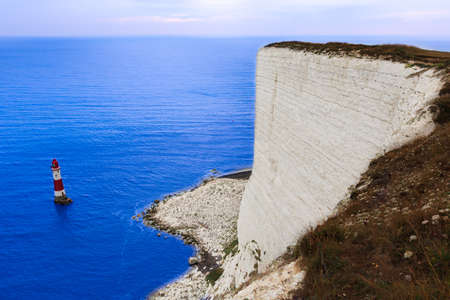 Beachy Head famous white cliffs and lighthouse in England.の写真素材