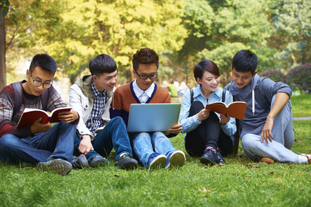 group of fice happy asian college students using laptop in campusの写真素材