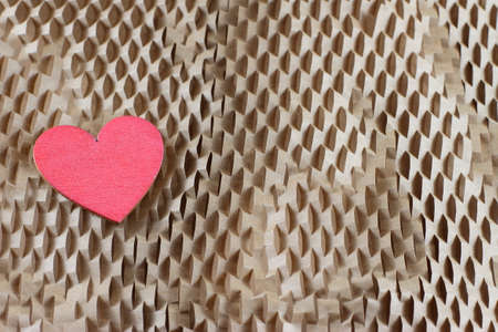 Heart Honeycomb cells of cardboard background, recycling paperの写真素材