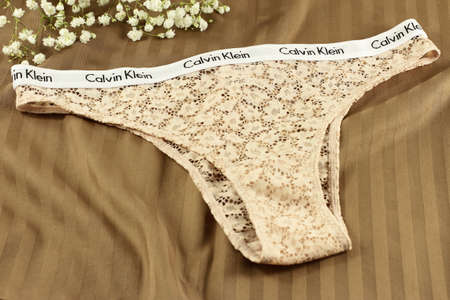 Sexy brand Calvin Klein panties on bed sheet, February 2022, Vitoria, Spain
