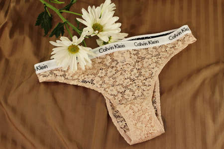 Sexy brand Calvin Klein panties on bed sheet, February 2022, Vitoria, Spainのeditorial素材