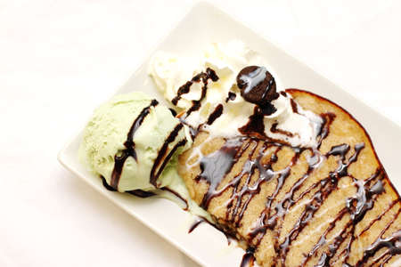 Homemade pancake with chocolate and ice creamの写真素材