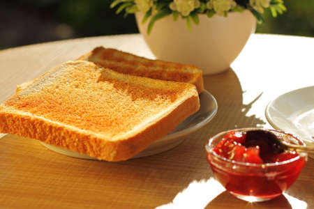 Coffee, toasted bread and butter for breakfast