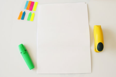 A4 paper on office table, supplies, pen, phone, blank paperの写真素材